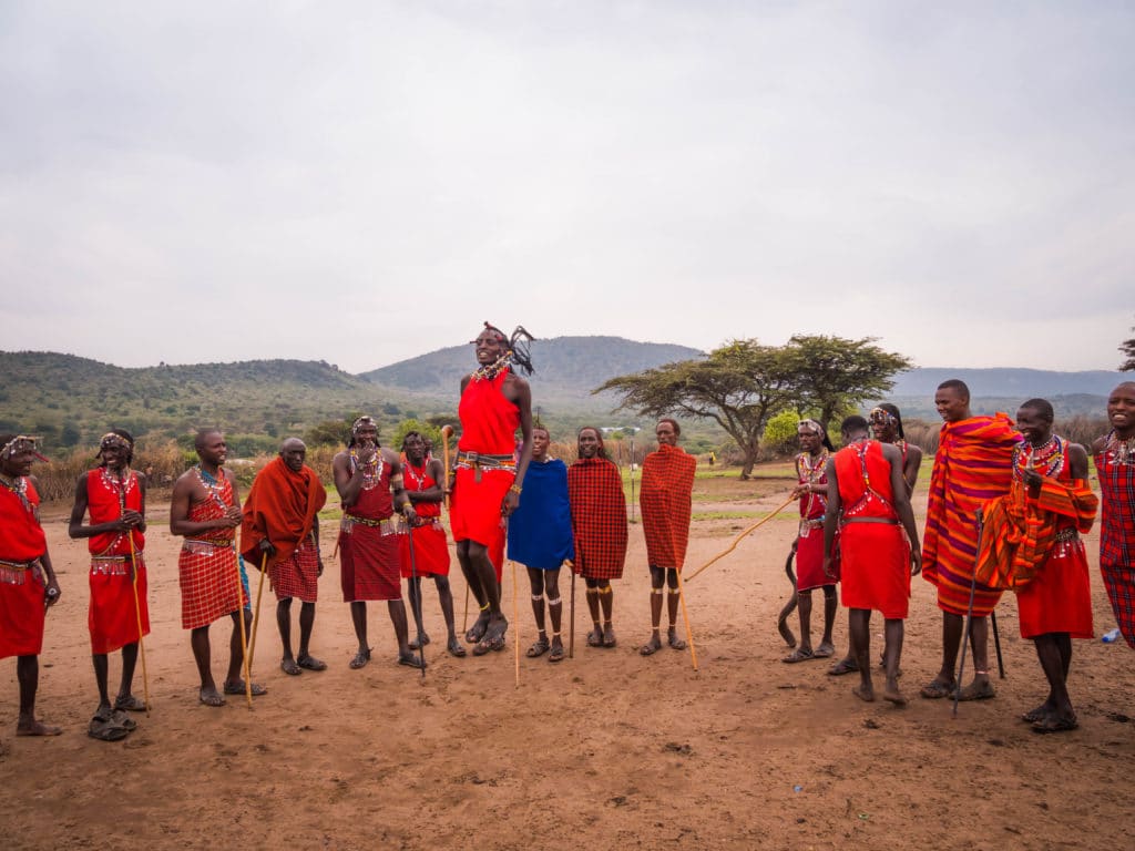 Travel - Visiting a Maasai Village - young Maasai man demonstrating adamu or the jumping dance