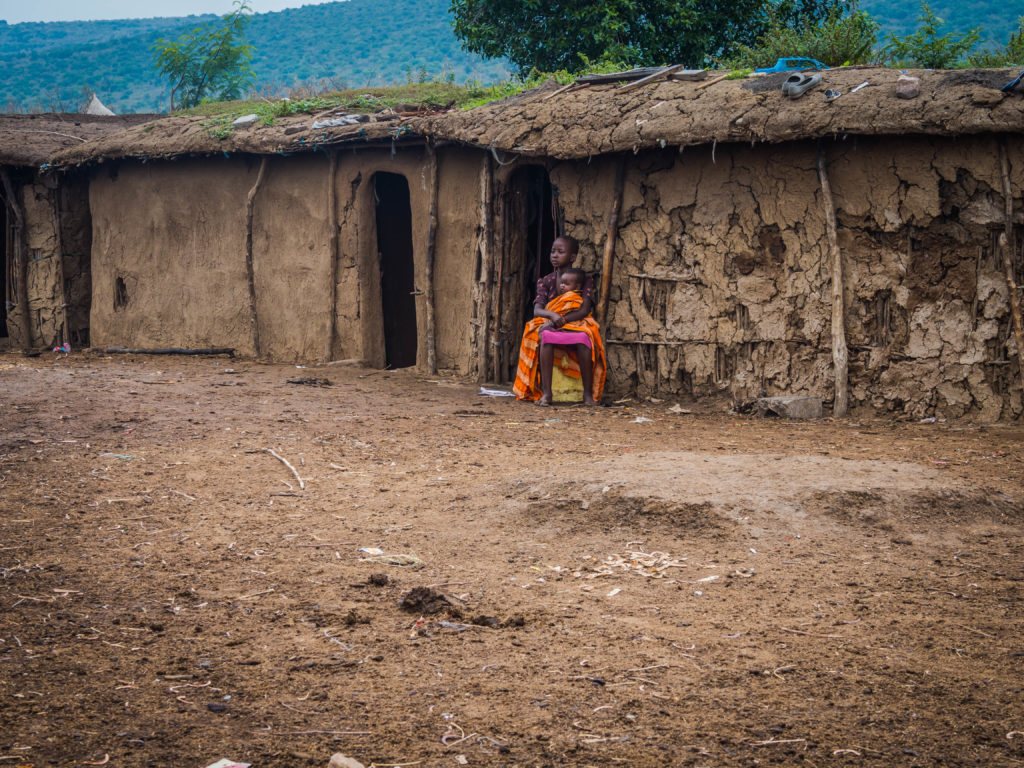 Travel - Visiting a Massai Village - Kenyan Children outside a traditional Maasai home